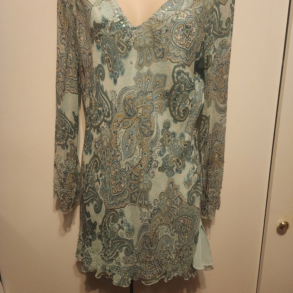 Silk top layer blouse.